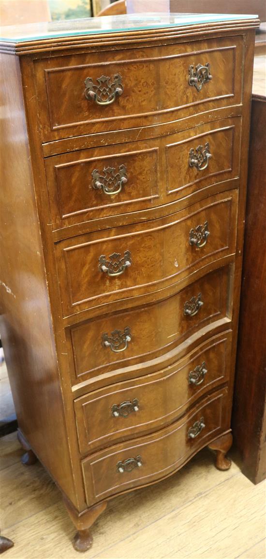A walnut serpentine slim chest, H.114cm